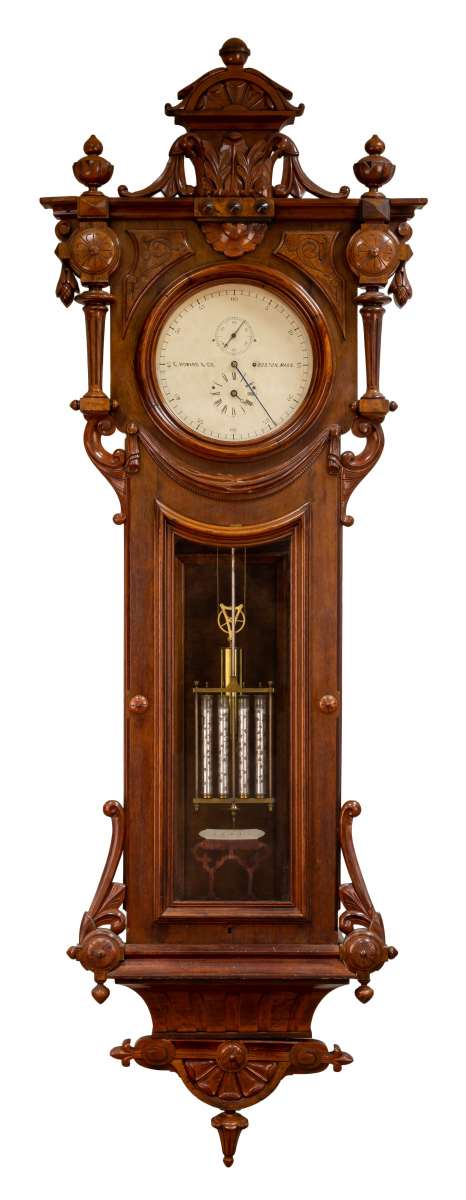 elaborately carved walnut and burl oversized case.